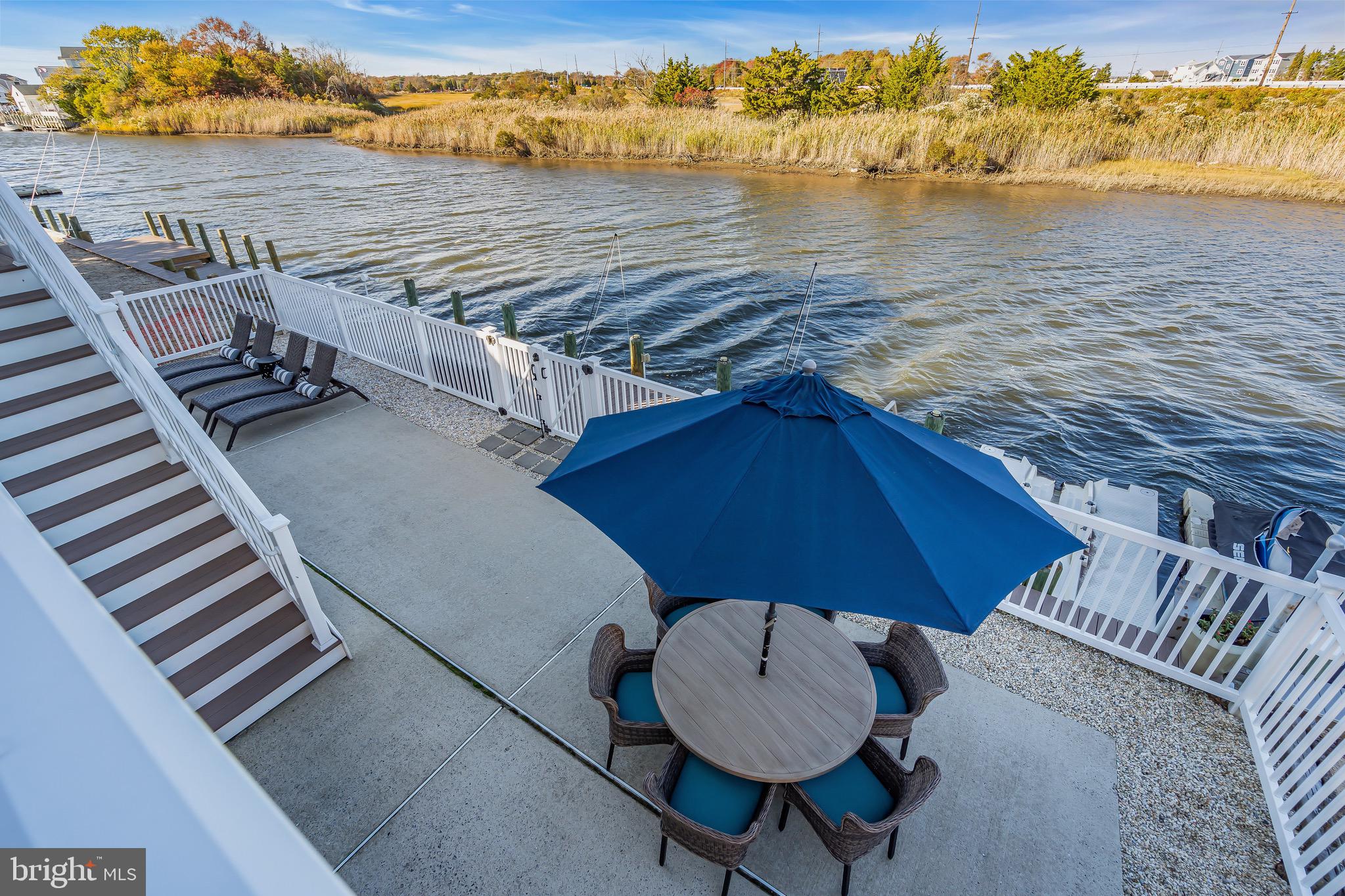 68 Morris Boulevard Manahawkin, NJ 08050 - Photo 34 of 43 a terrace with outdoor seating and water view