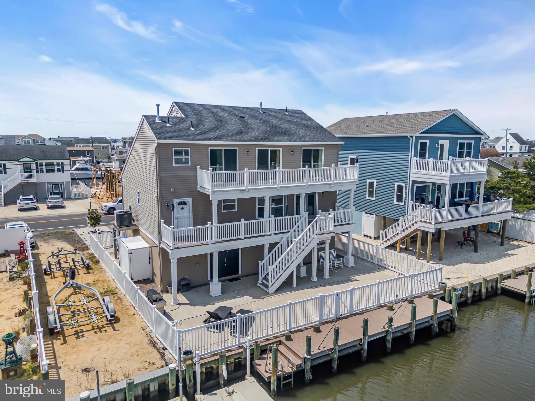 68 Morris Boulevard Manahawkin, NJ 08050 - Photo 43 of 43 a view of a house with pool and lawn chairs