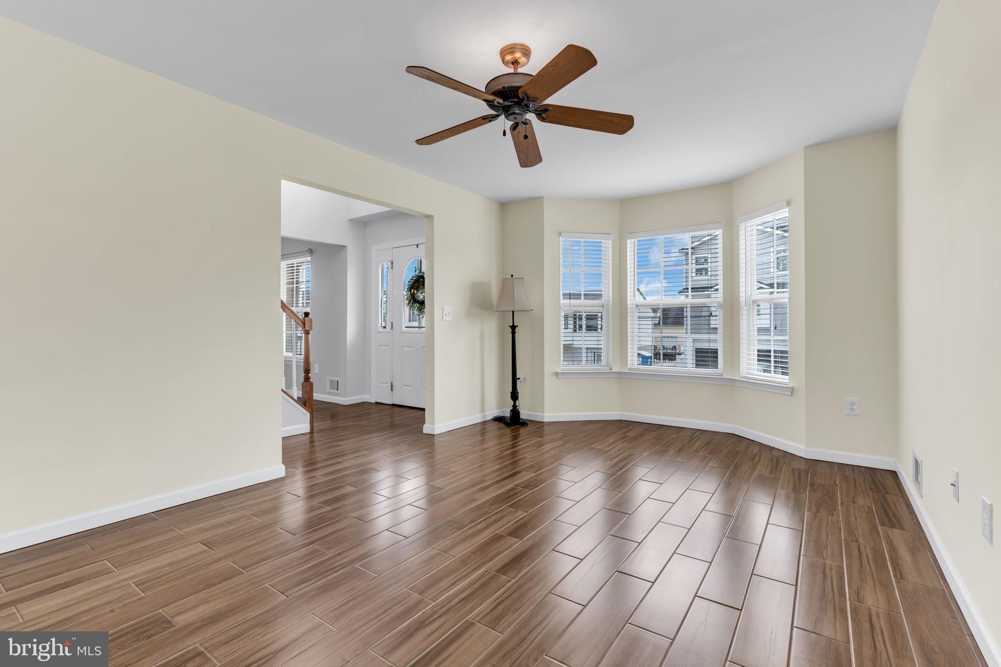 68 Morris Boulevard Manahawkin, NJ 08050 - Photo 7 of 43 wooden floor in an empty room with a window
