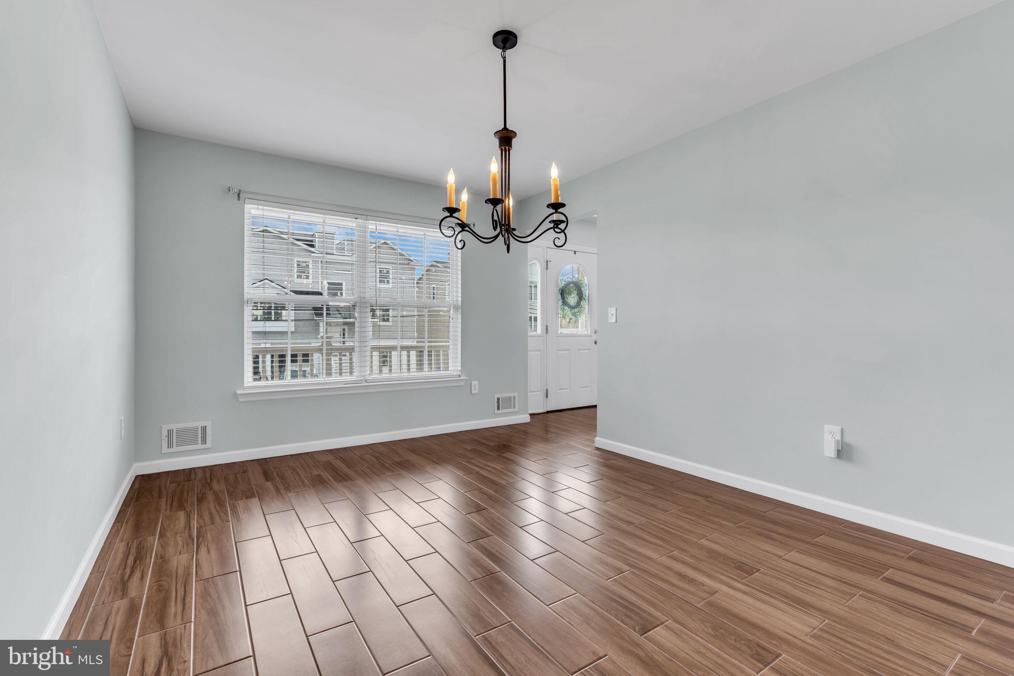 68 Morris Boulevard Manahawkin, NJ 08050 - Photo 8 of 43 wooden floor in an empty room with a window