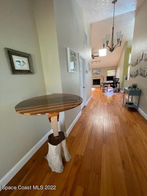 866 Spanish Wells Drive Melbourne, FL 32940 - Photo 12 of 18 a dining room with furniture and wooden floor