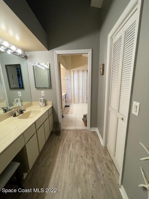 866 Spanish Wells Drive Melbourne, FL 32940 - Photo 15 of 18 a bathroom with a sink mirror vanity and toilet