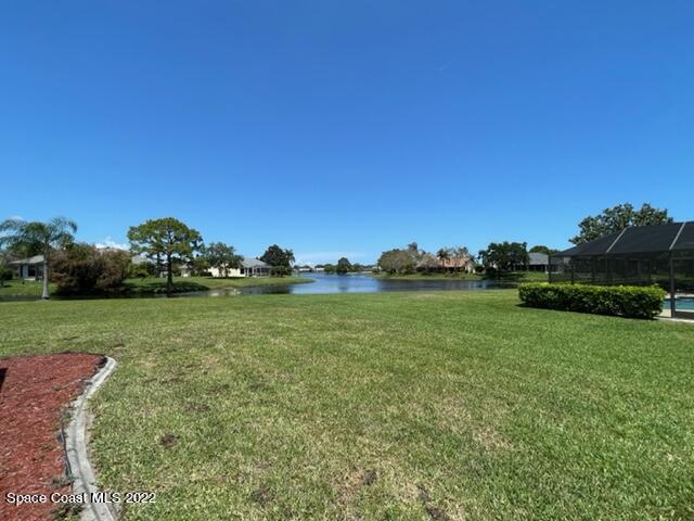 866 Spanish Wells Drive Melbourne, FL 32940 - Photo 18 of 18 a backyard of a house with lots of green space