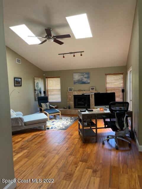 866 Spanish Wells Drive Melbourne, FL 32940 - Photo 4 of 18 a living room with furniture and a wooden floor