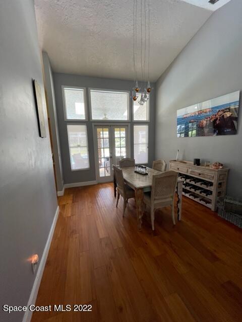 866 Spanish Wells Drive Melbourne, FL 32940 - Photo 5 of 18 a view of a dining room with furniture and wooden floor