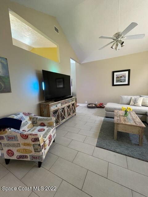 866 Spanish Wells Drive Melbourne, FL 32940 - Photo 8 of 18 a bedroom with furniture and a flat screen tv