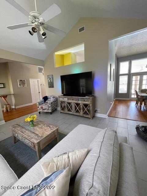 866 Spanish Wells Drive Melbourne, FL 32940 - Photo 10 of 18 a living room with furniture and a flat screen tv