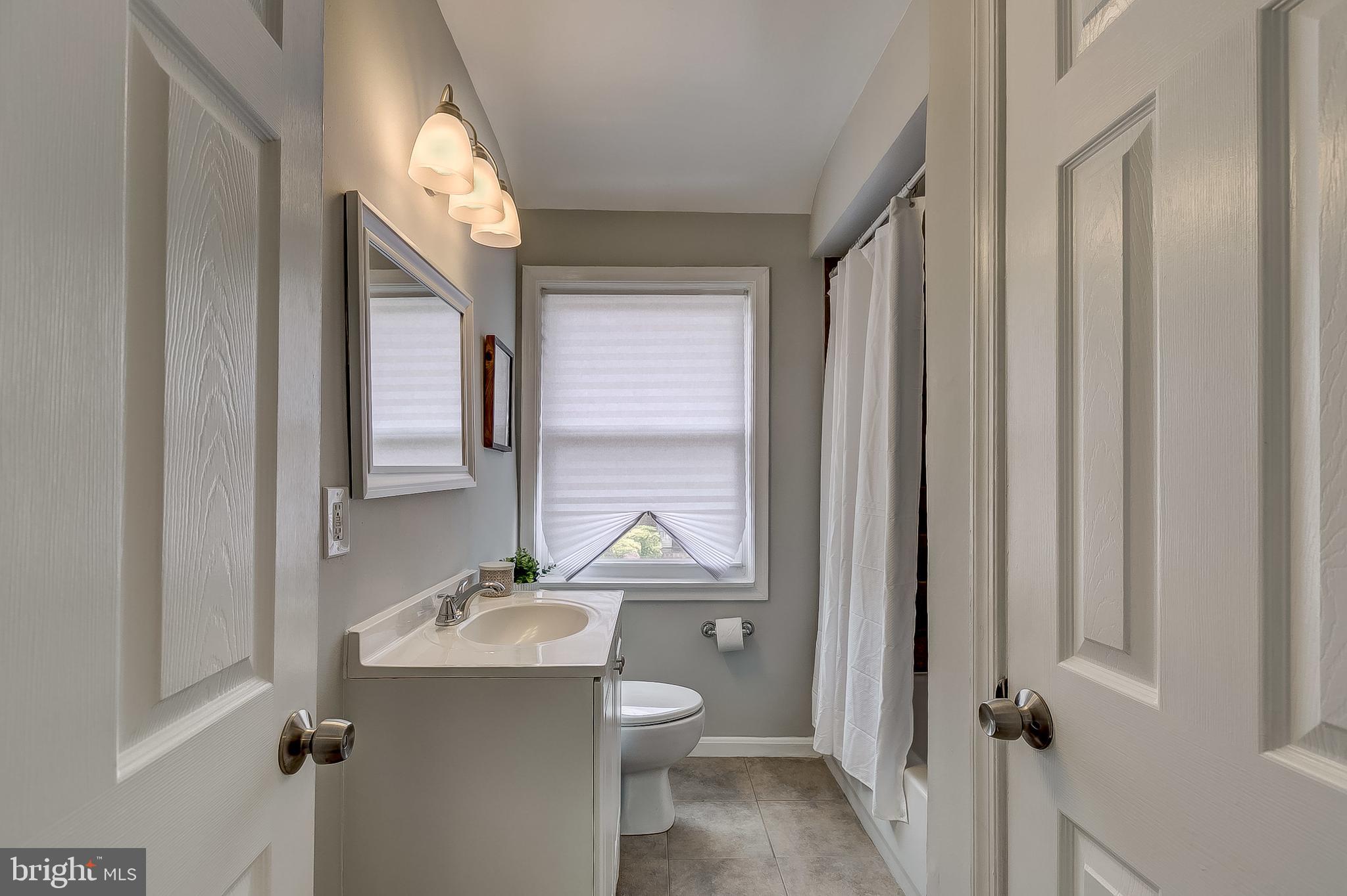 1306 Silverthorne Road Baltimore, MD 21239 - Photo 21 of 31 Step into the Upper Level Full Bathroom