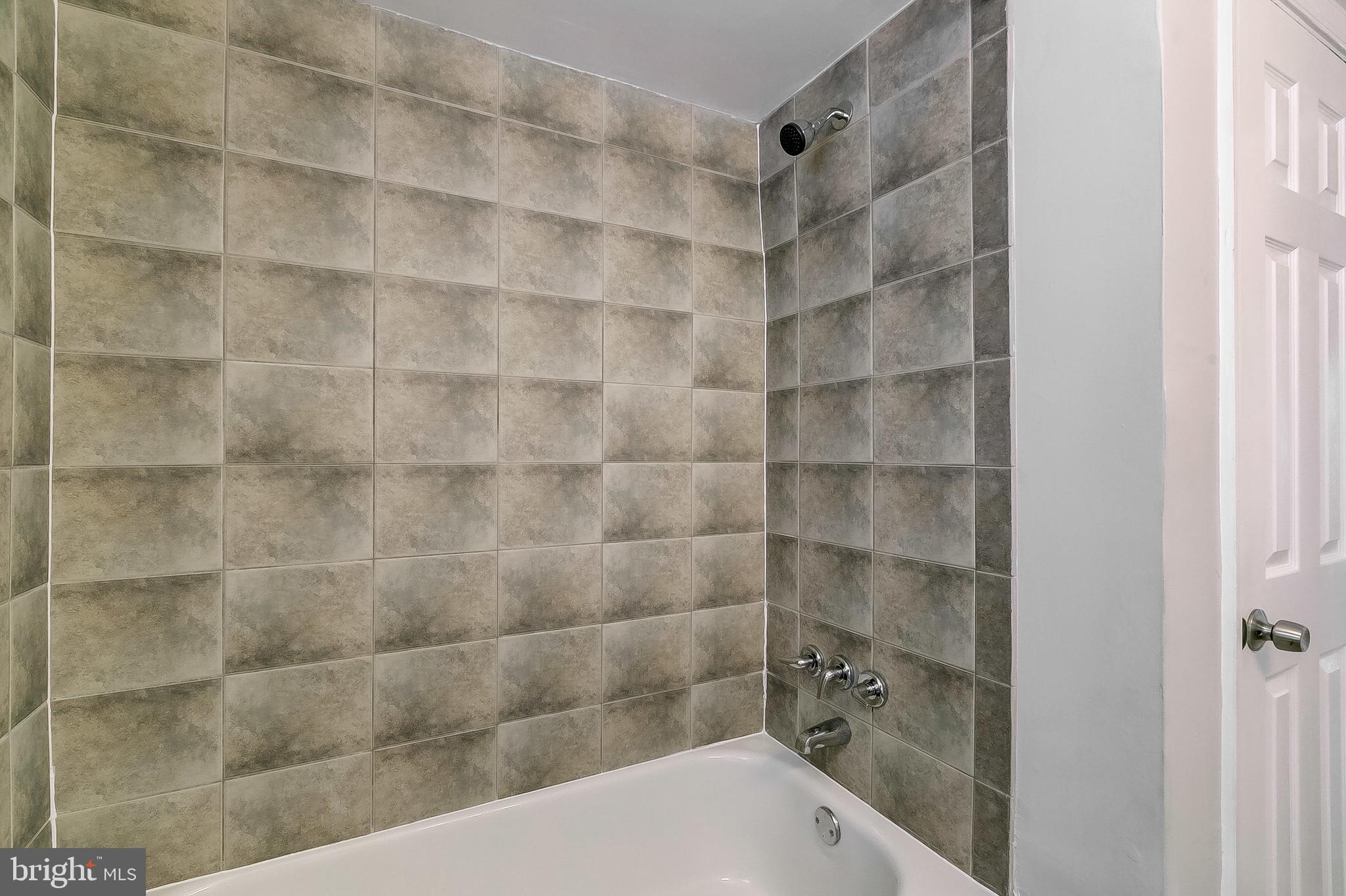 1306 Silverthorne Road Baltimore, MD 21239 - Photo 23 of 31 Tiled Background in Tub and Shower Combo!