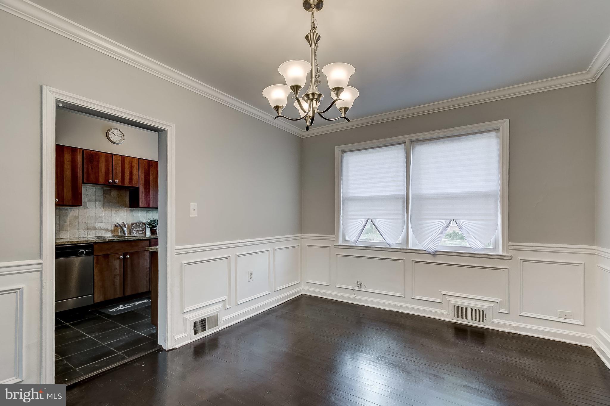 1306 Silverthorne Road Baltimore, MD 21239 - Photo 8 of 31 Beautiful Dining Area:Crown & Chair Rail Moulding
