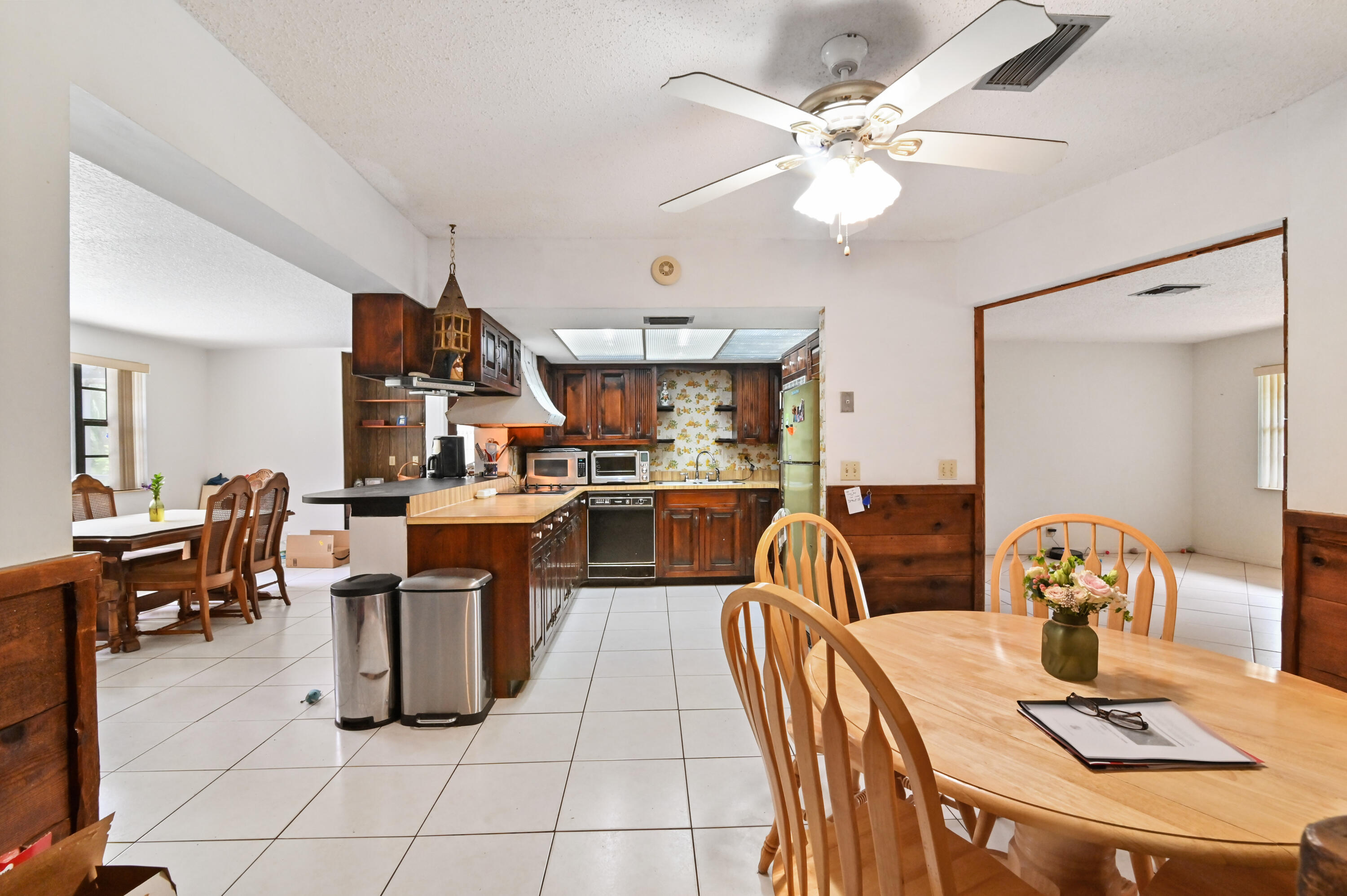 3208 A Road Loxahatchee Groves, FL 33470 - Photo 11 of 51 a living room with lots of furniture and appliances