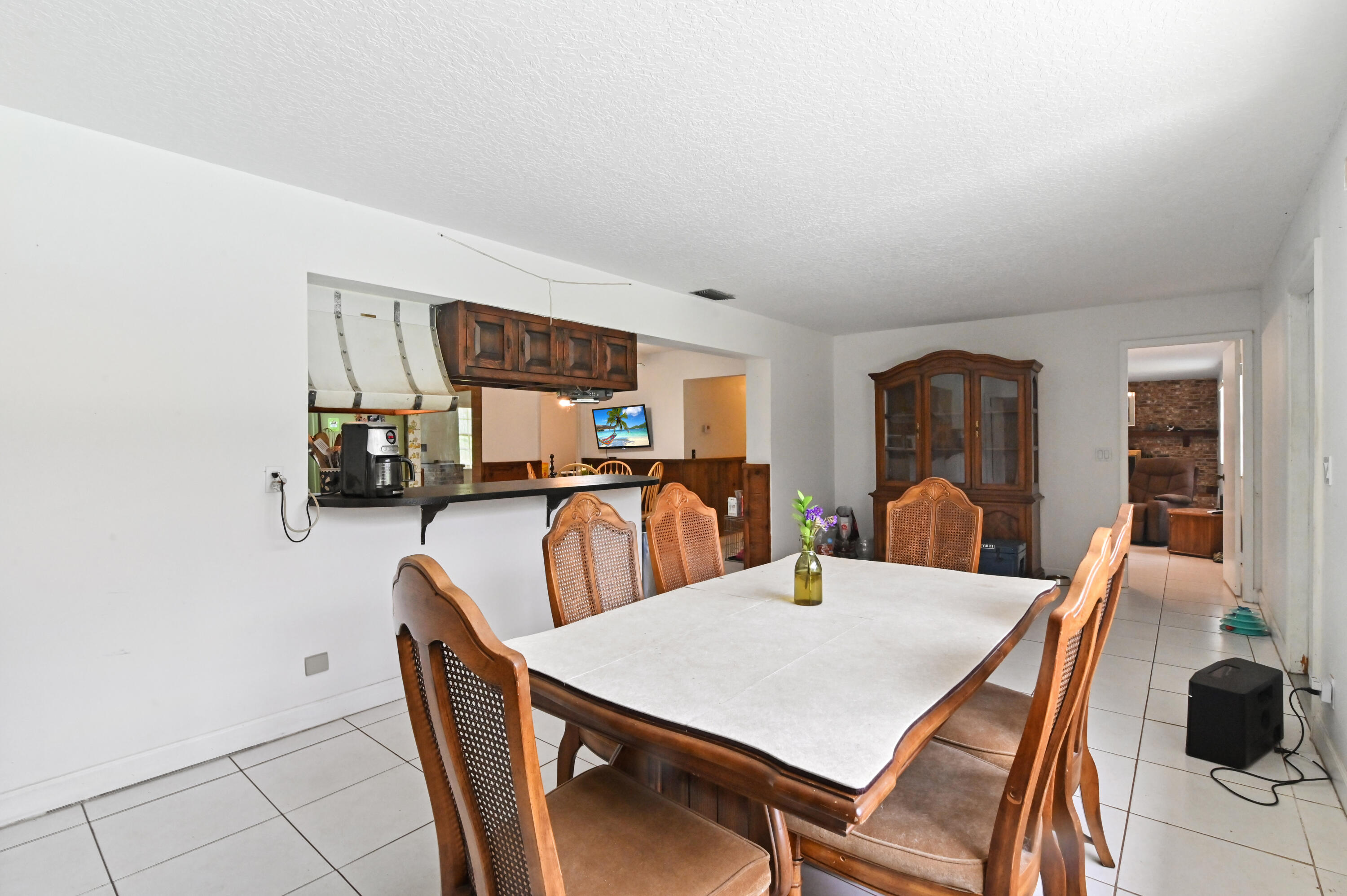 3208 A Road Loxahatchee Groves, FL 33470 - Photo 13 of 51 a view of a dining room with furniture