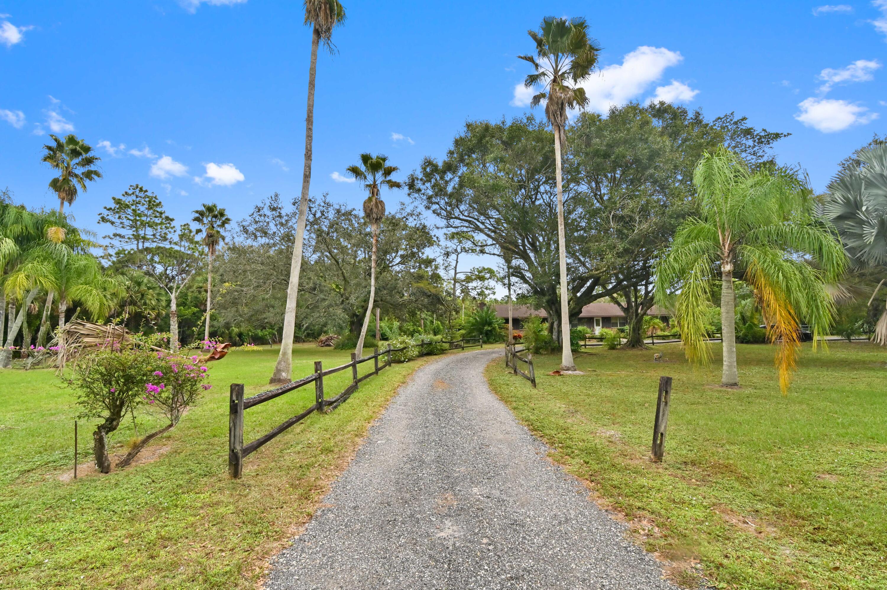 3208 A Road Loxahatchee Groves, FL 33470 - Photo 2 of 51 a view of a park with swings