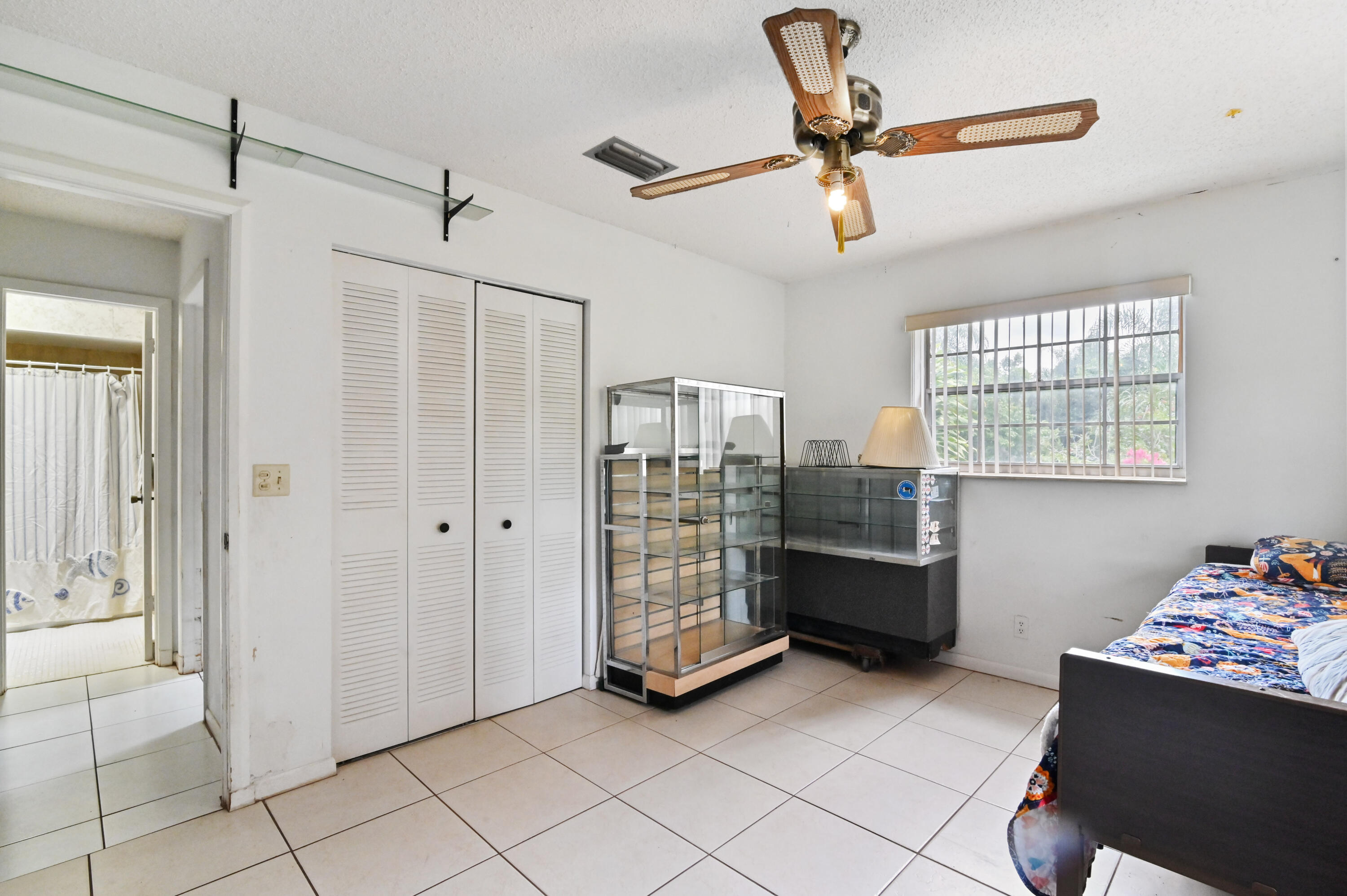 3208 A Road Loxahatchee Groves, FL 33470 - Photo 24 of 51 a view of room with window and a ceiling fan