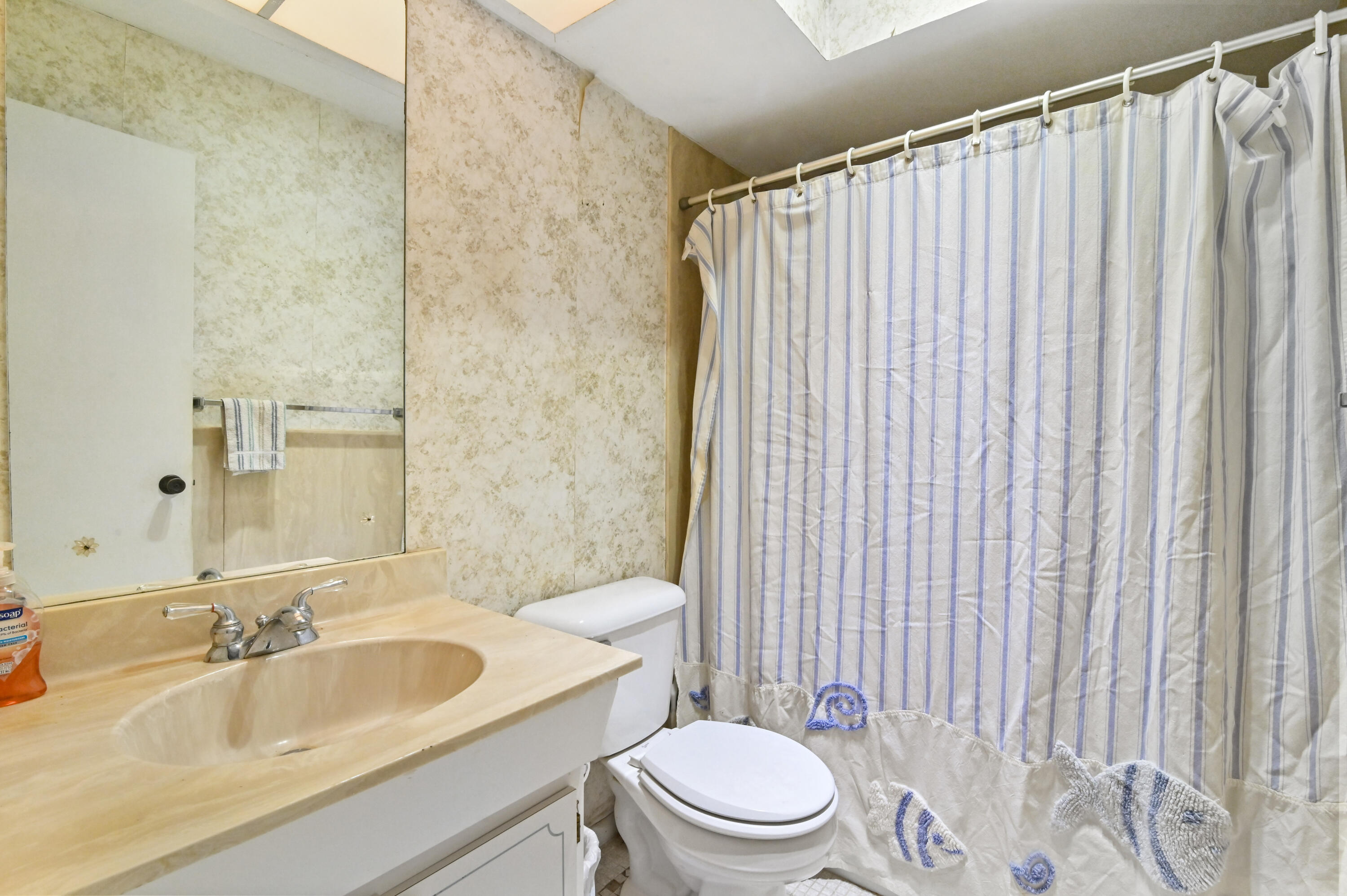 3208 A Road Loxahatchee Groves, FL 33470 - Photo 26 of 51 a bathroom with a sink toilet and shower