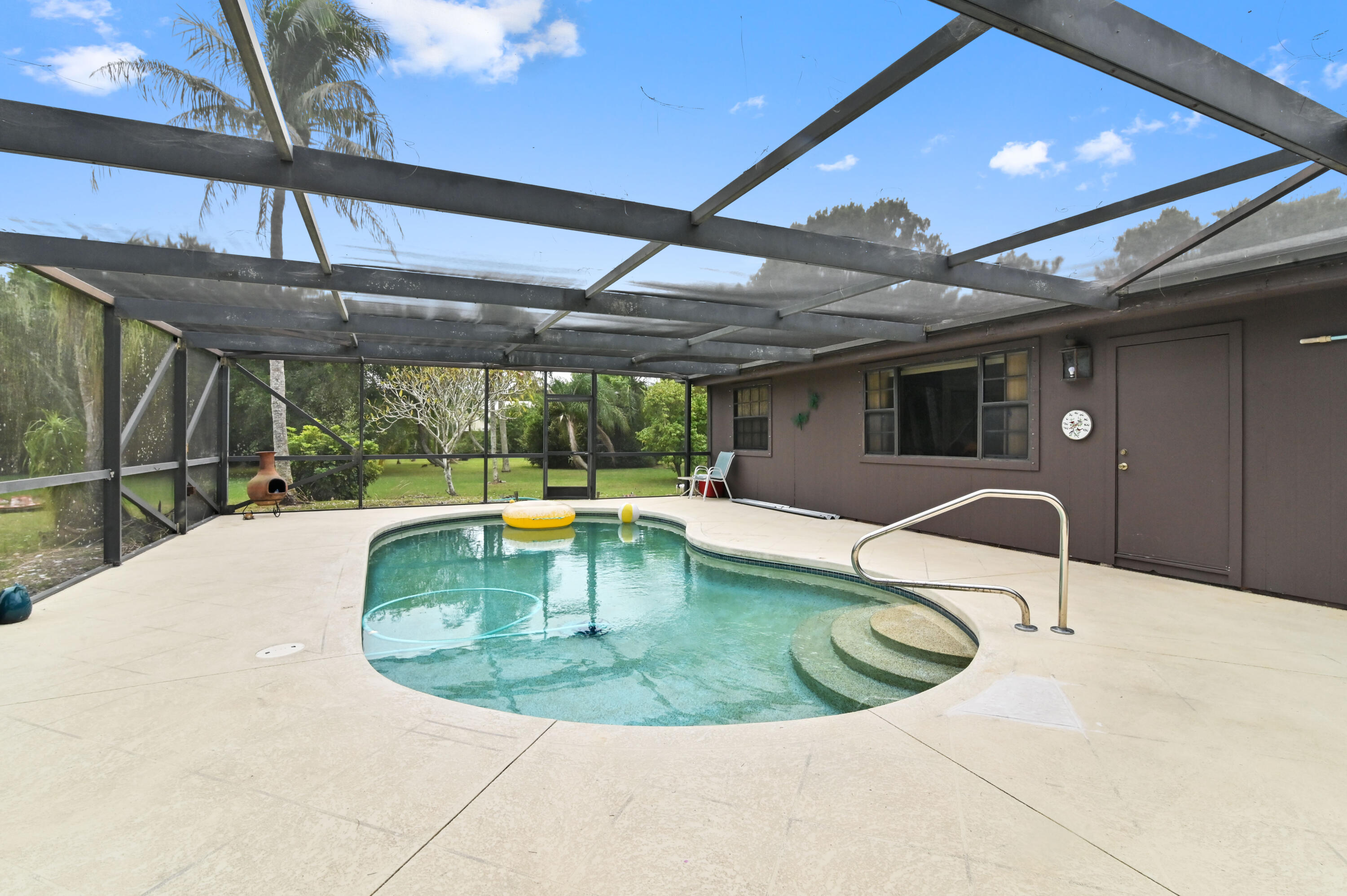 3208 A Road Loxahatchee Groves, FL 33470 - Photo 34 of 51 a view of a swimming pool