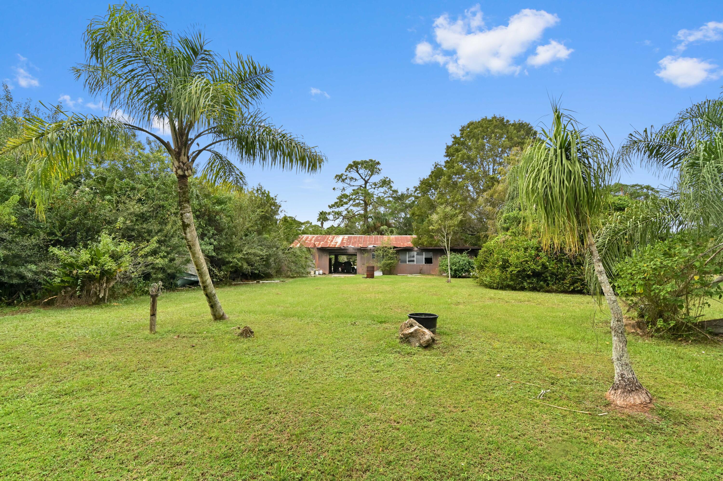 3208 A Road Loxahatchee Groves, FL 33470 - Photo 37 of 51 a view of a backyard