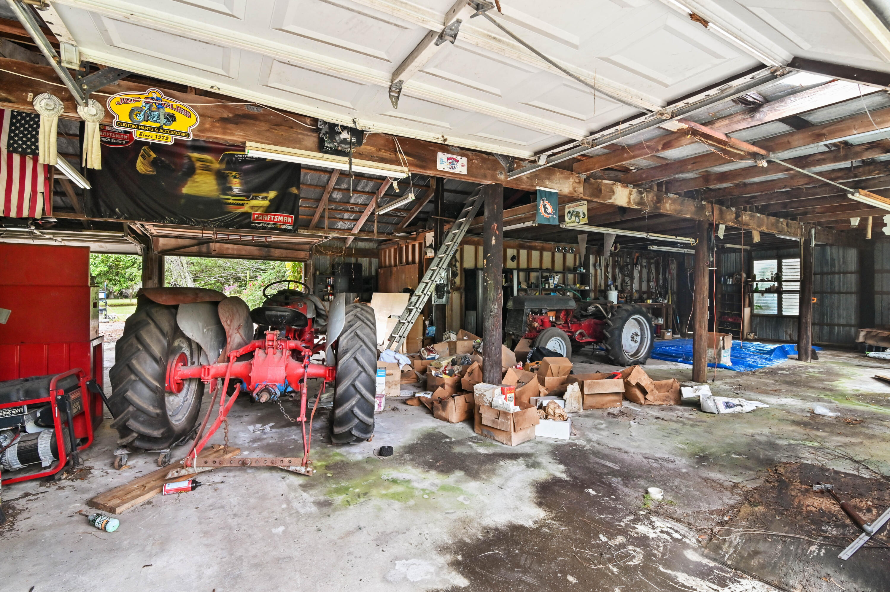 3208 A Road Loxahatchee Groves, FL 33470 - Photo 38 of 51 a view of a storage room with a lot of stuff