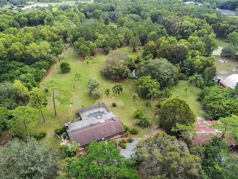 3208 A Road Loxahatchee Groves, FL 33470 - Photo 41 of 51 an aerial view of a house with a yard