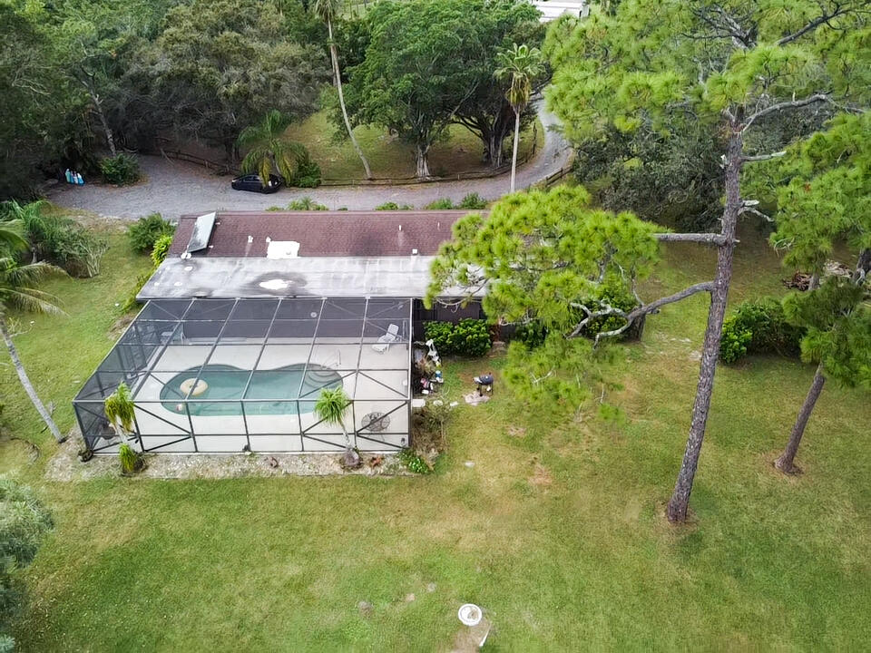 3208 A Road Loxahatchee Groves, FL 33470 - Photo 47 of 51 an aerial view of a house with pool garden and outdoor seating