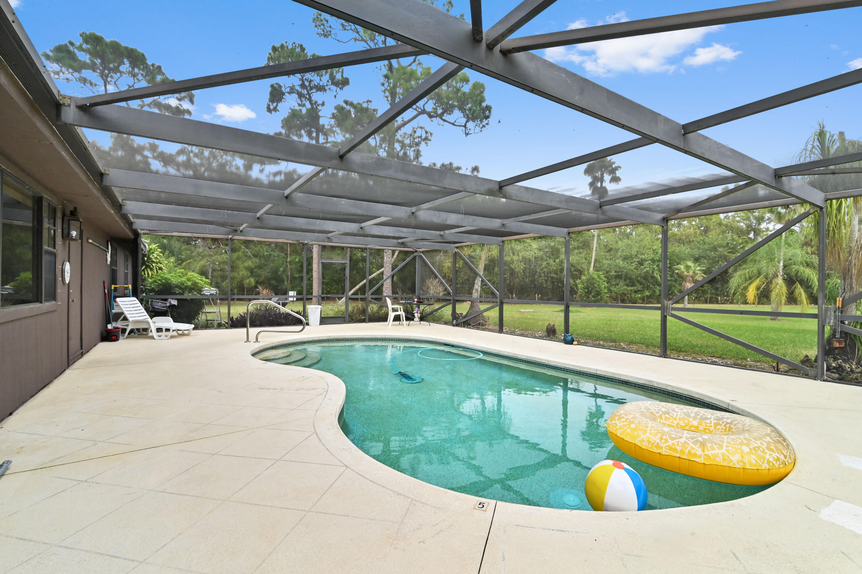 3208 A Road Loxahatchee Groves, FL 33470 - Photo 5 of 51 a view of a swimming pool with a patio
