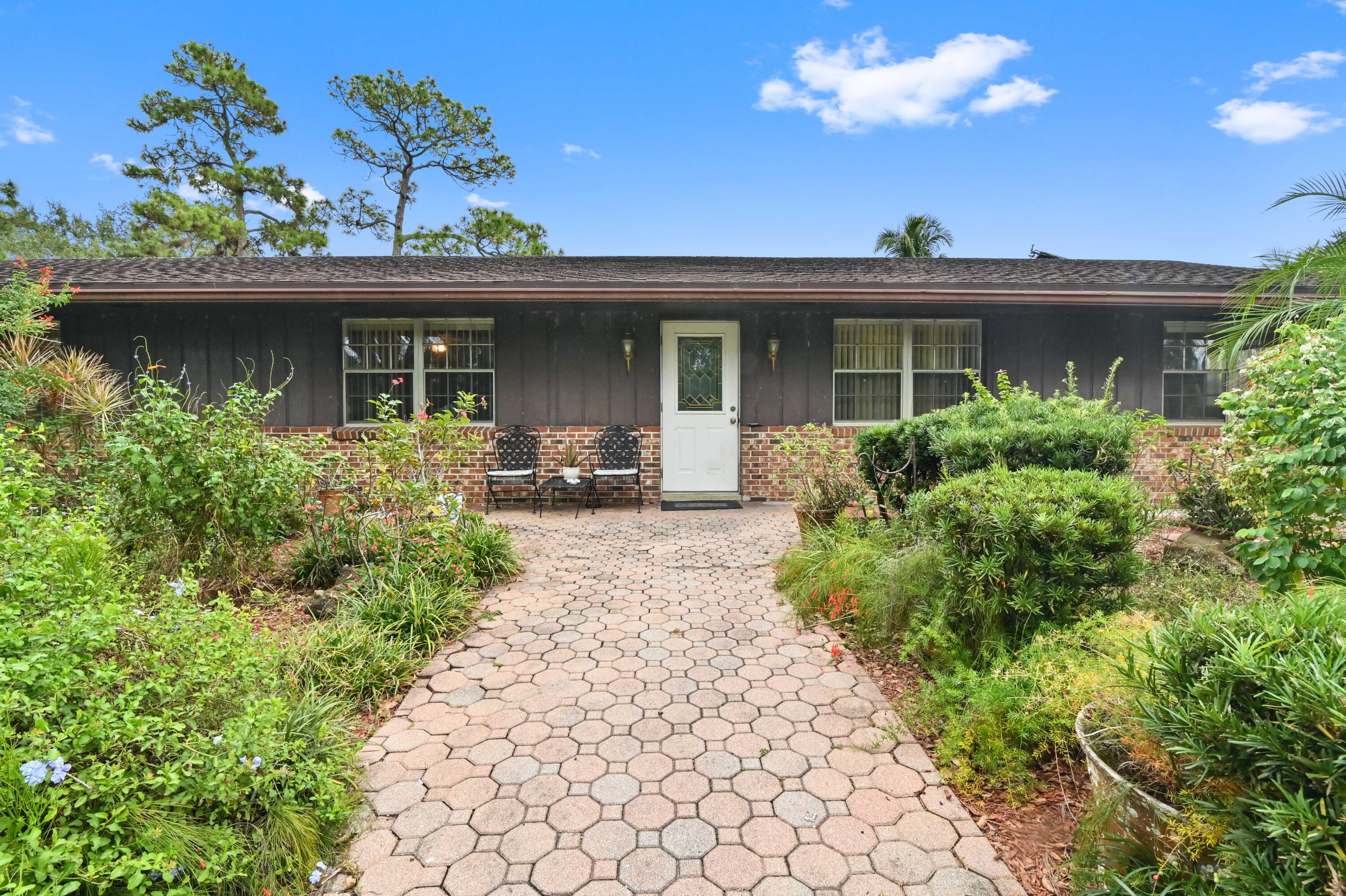 3208 A Road Loxahatchee Groves, FL 33470 - Photo 51 of 51 a front view of a house with a porch