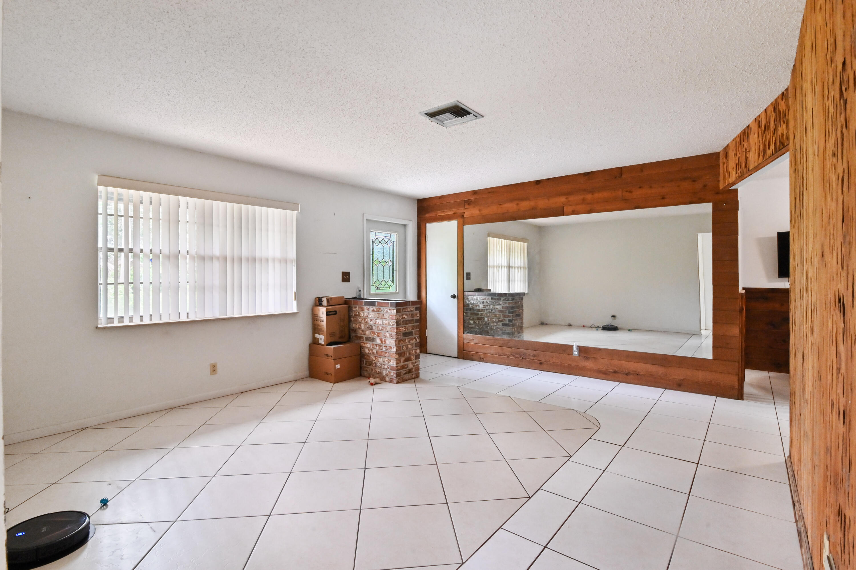 3208 A Road Loxahatchee Groves, FL 33470 - Photo 7 of 51 a view of an empty room with window and a kitchen