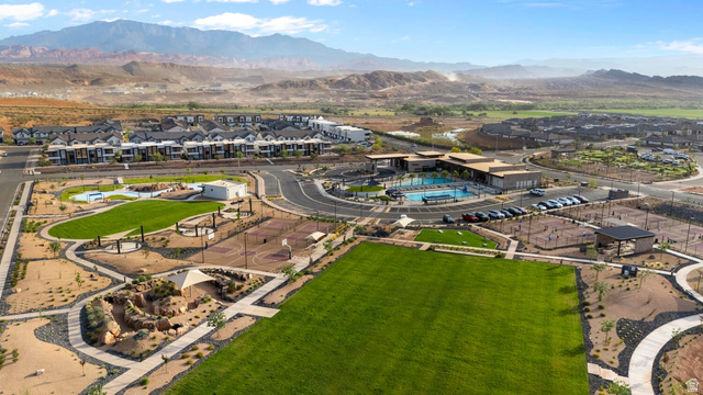 2133 Wolverine Way, Unit 2440 Washington, UT 84780 - Photo 38 of 39 Expansive community grounds featuring a large green space, a multi-court sports area, and a structured play area