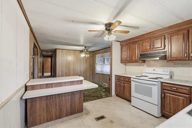 a kitchen sink sitting next to a window