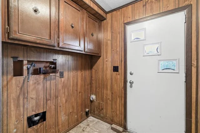 a bathroom with a sink vanity granite tub and shower