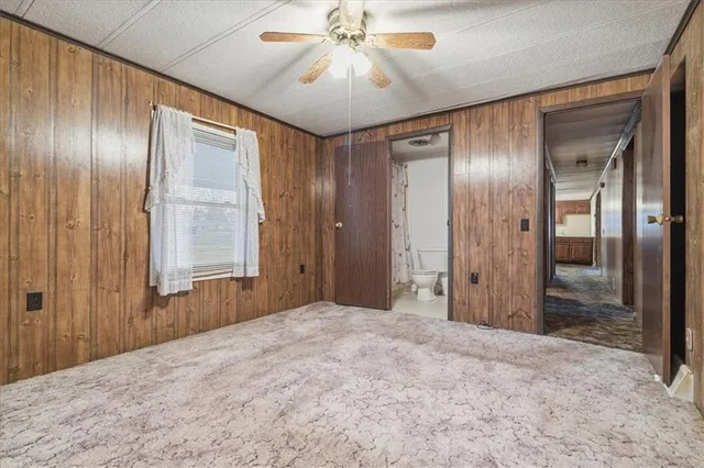 a view of a livingroom with a chandelier fan