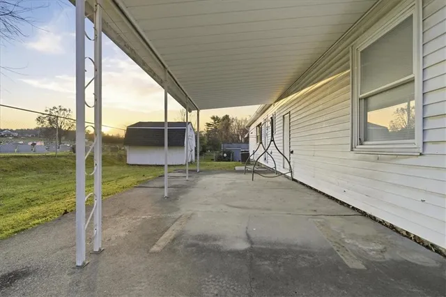 a view of a balcony with wooden floor