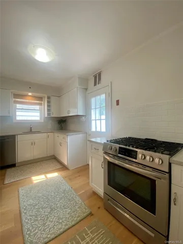 a kitchen with a stove and a cabinet