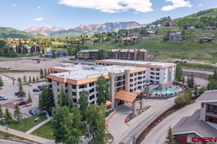 6 Emmons Road, Unit 553 Crested Butte, CO 81225 - Photo 15 of 27 an aerial view of a house with a garden and lake view