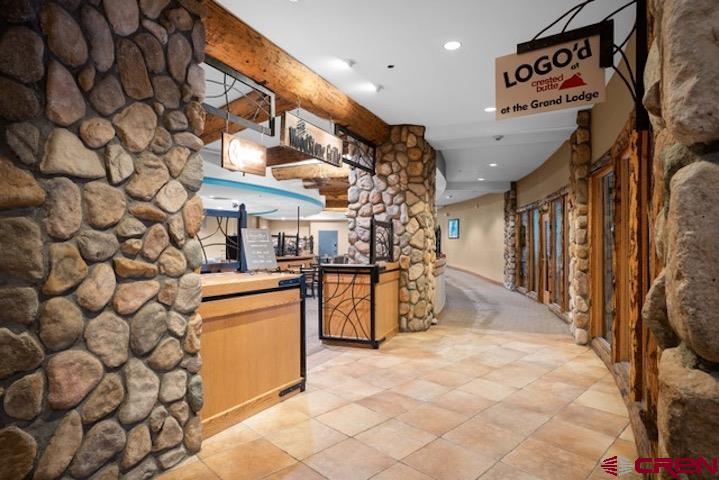 6 Emmons Road, Unit 553 Crested Butte, CO 81225 - Photo 25 of 27 a open kitchen with a sink and cabinets