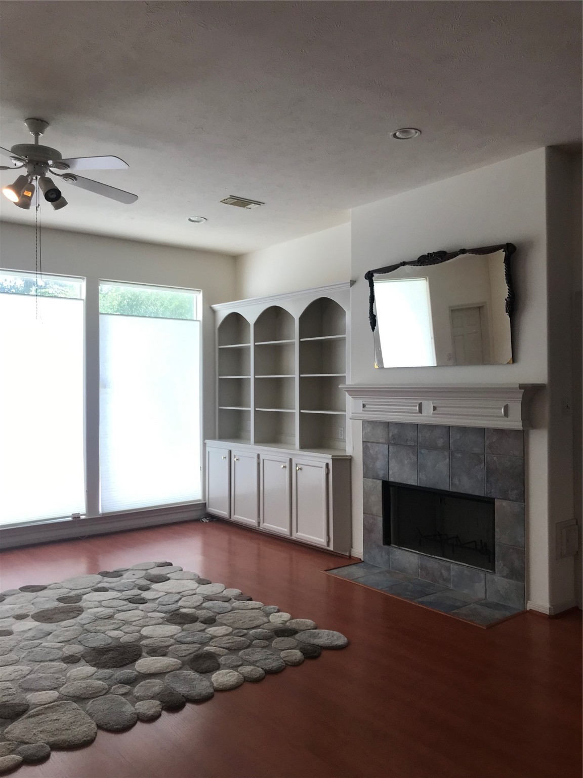 2429 Chantilly Lane Conroe, TX 77384 - Photo 14 of 27 a view of an empty room with a fireplace and a window
