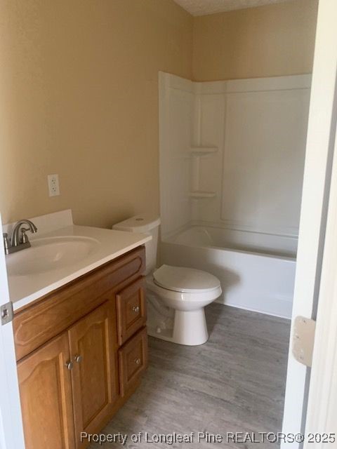 209 Godwin Street, Unit A Pembroke, NC 28372 - Photo 5 of 6 a bathroom with a sink a toilet and shower