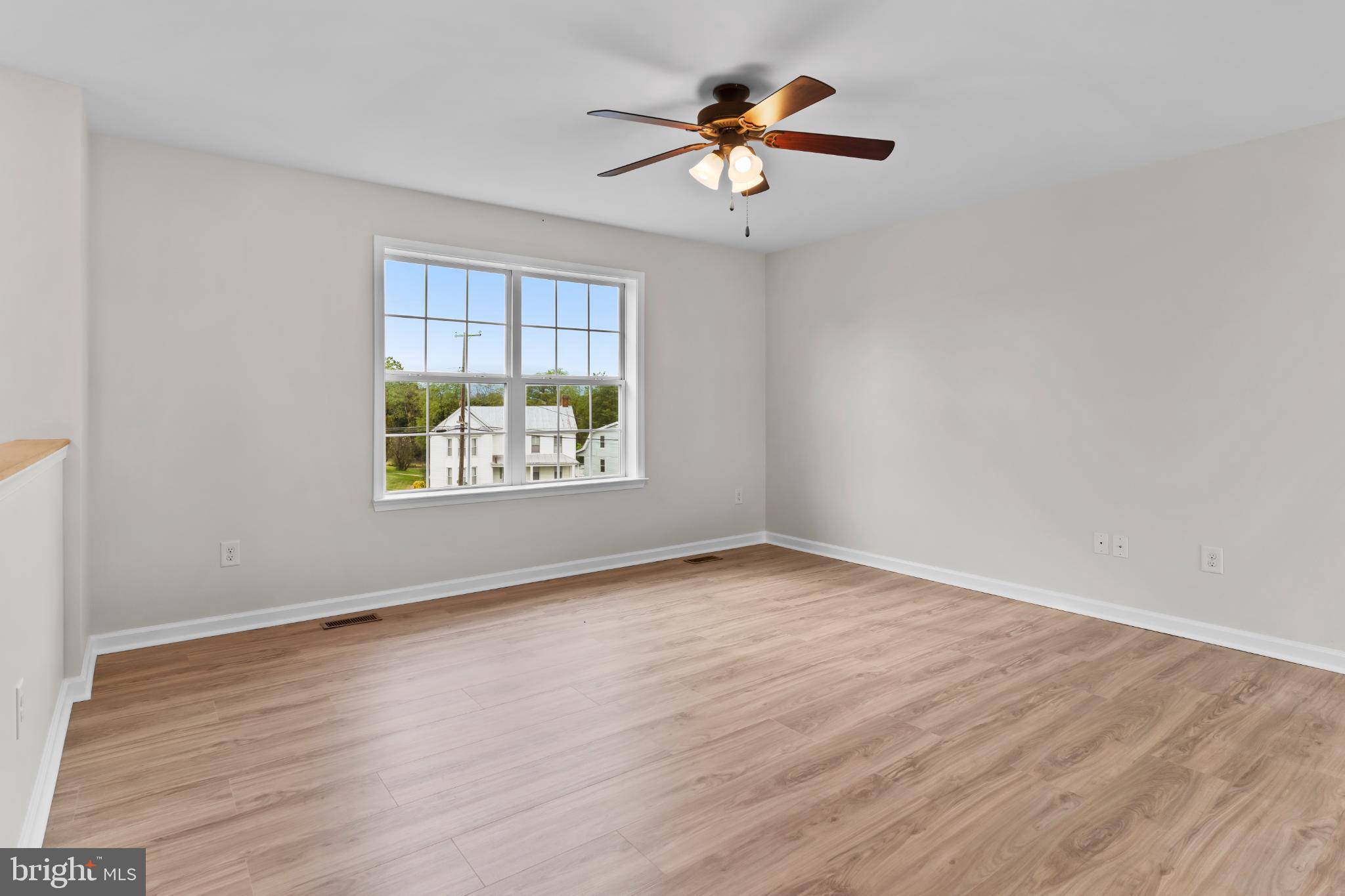 99 Middle Spring Road Shippensburg, PA 17257 - Photo 15 of 27 an empty room with a window and a ceiling fan