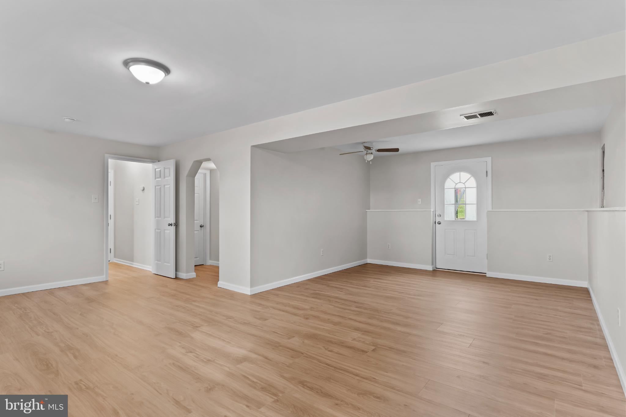 99 Middle Spring Road Shippensburg, PA 17257 - Photo 25 of 27 a view of an empty room with window and wooden floor