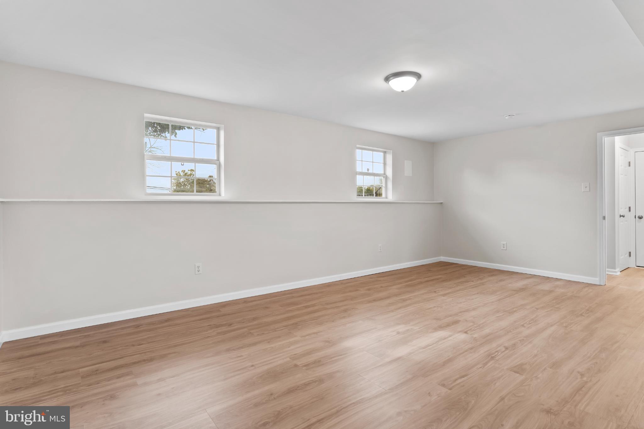 99 Middle Spring Road Shippensburg, PA 17257 - Photo 26 of 27 a view of an empty room with wooden floor and a window