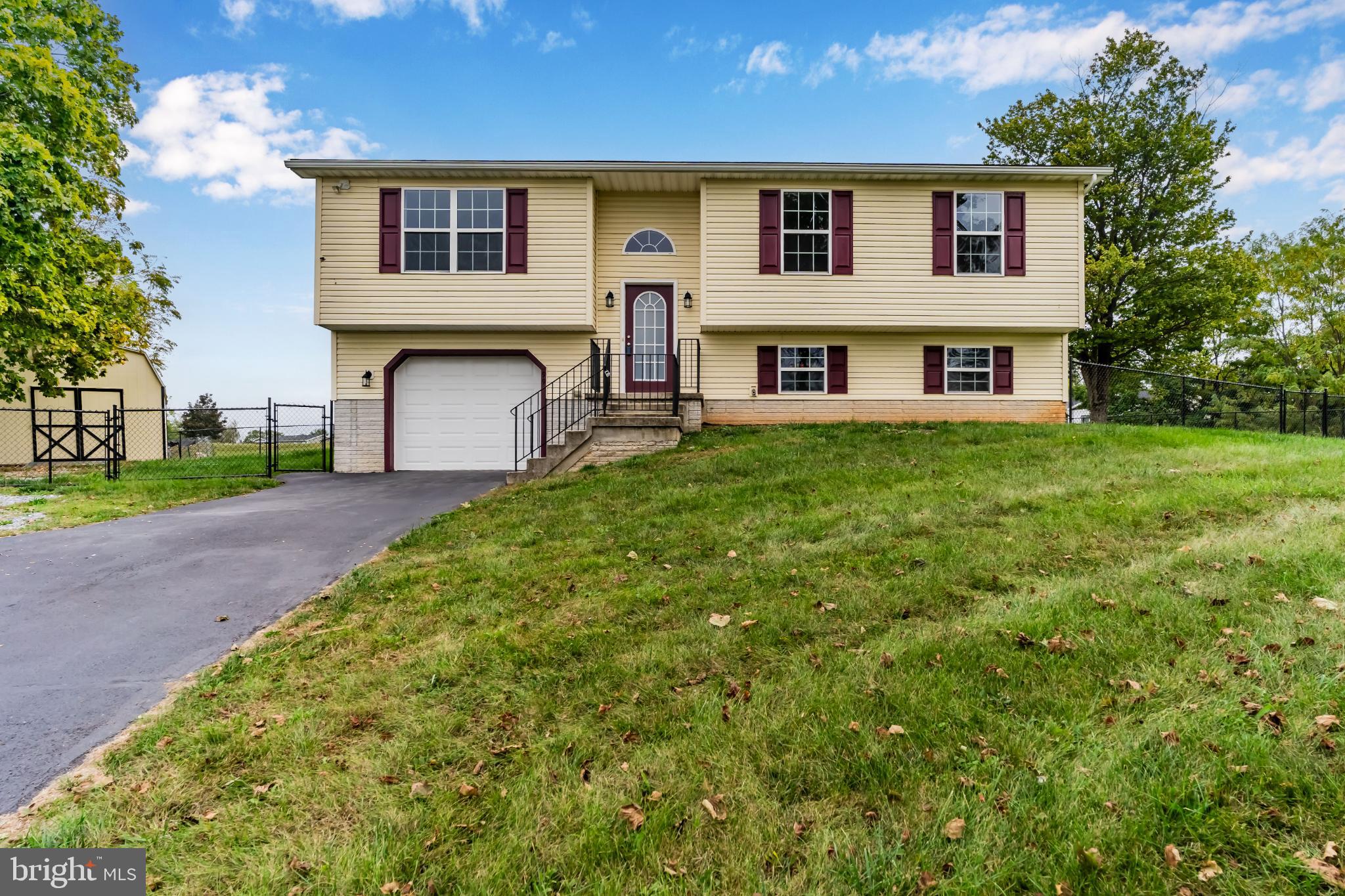 99 Middle Spring Road Shippensburg, PA 17257 - Photo 3 of 27 a view of house with yard and car parked