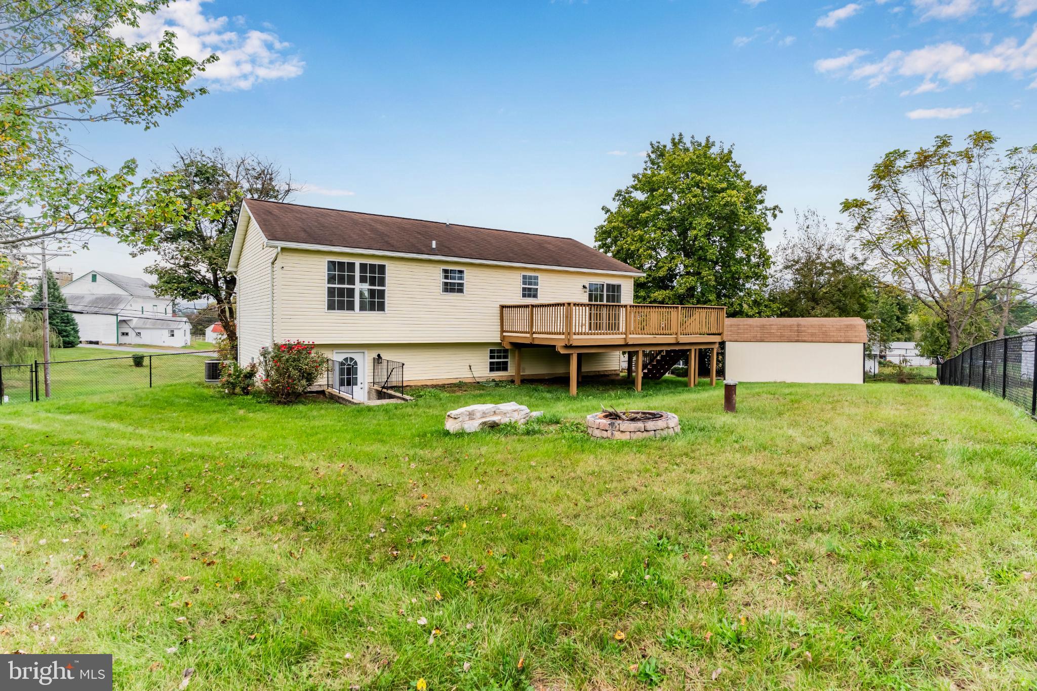 99 Middle Spring Road Shippensburg, PA 17257 - Photo 4 of 27 a front view of a house with a yard and trees