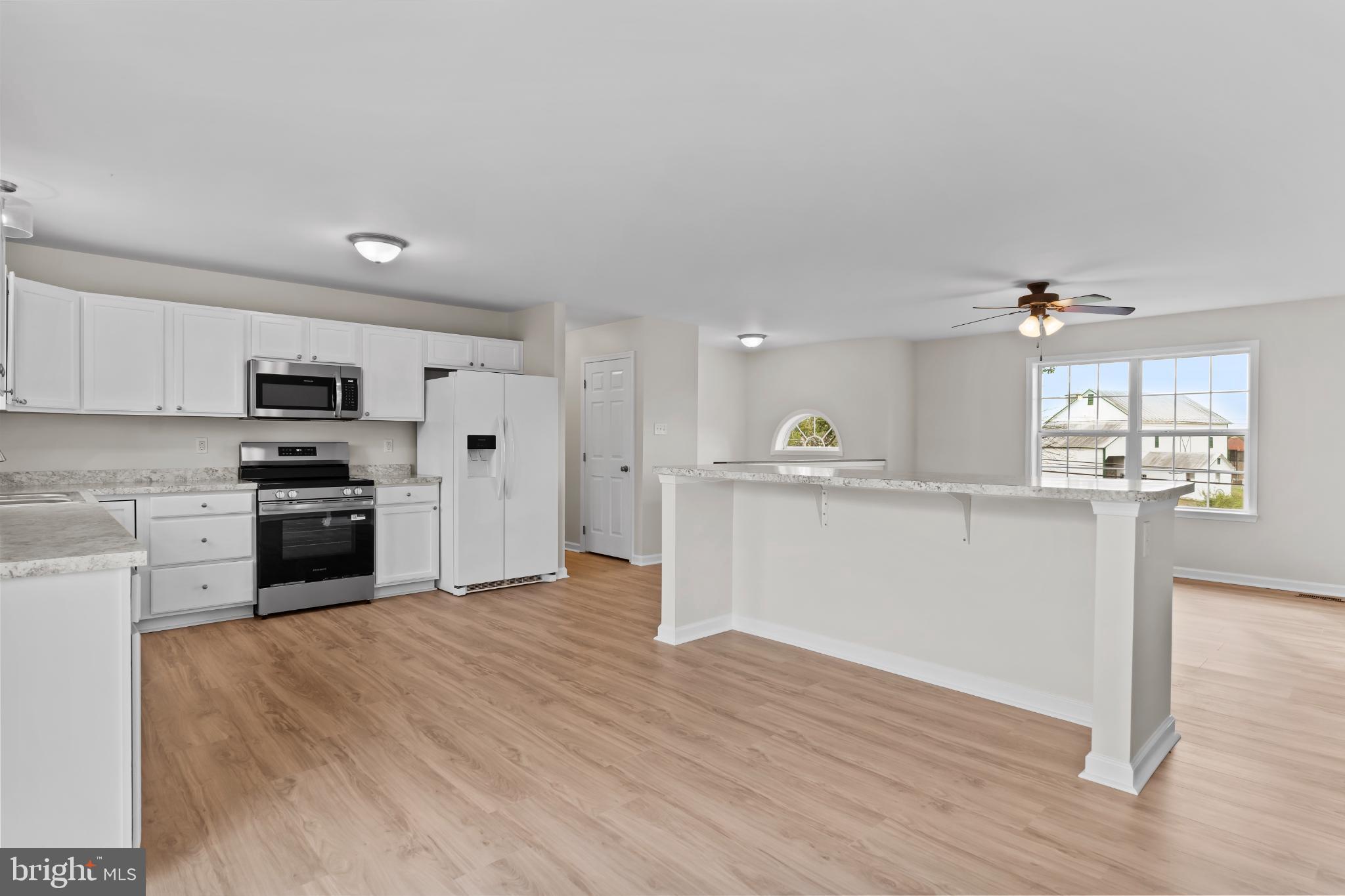 99 Middle Spring Road Shippensburg, PA 17257 - Photo 7 of 27 a view of kitchen with granite countertop stainless steel appliances and sink