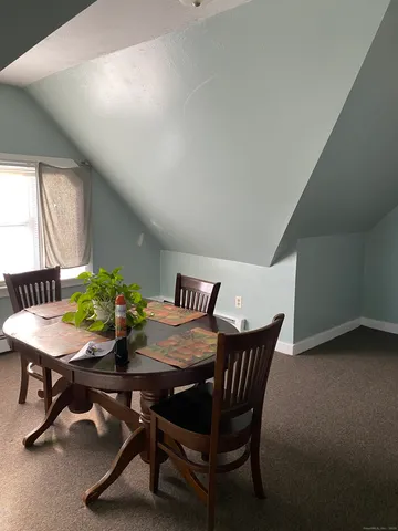 a view of room with chair and a window