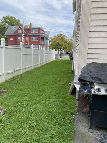 a view of a house with a backyard