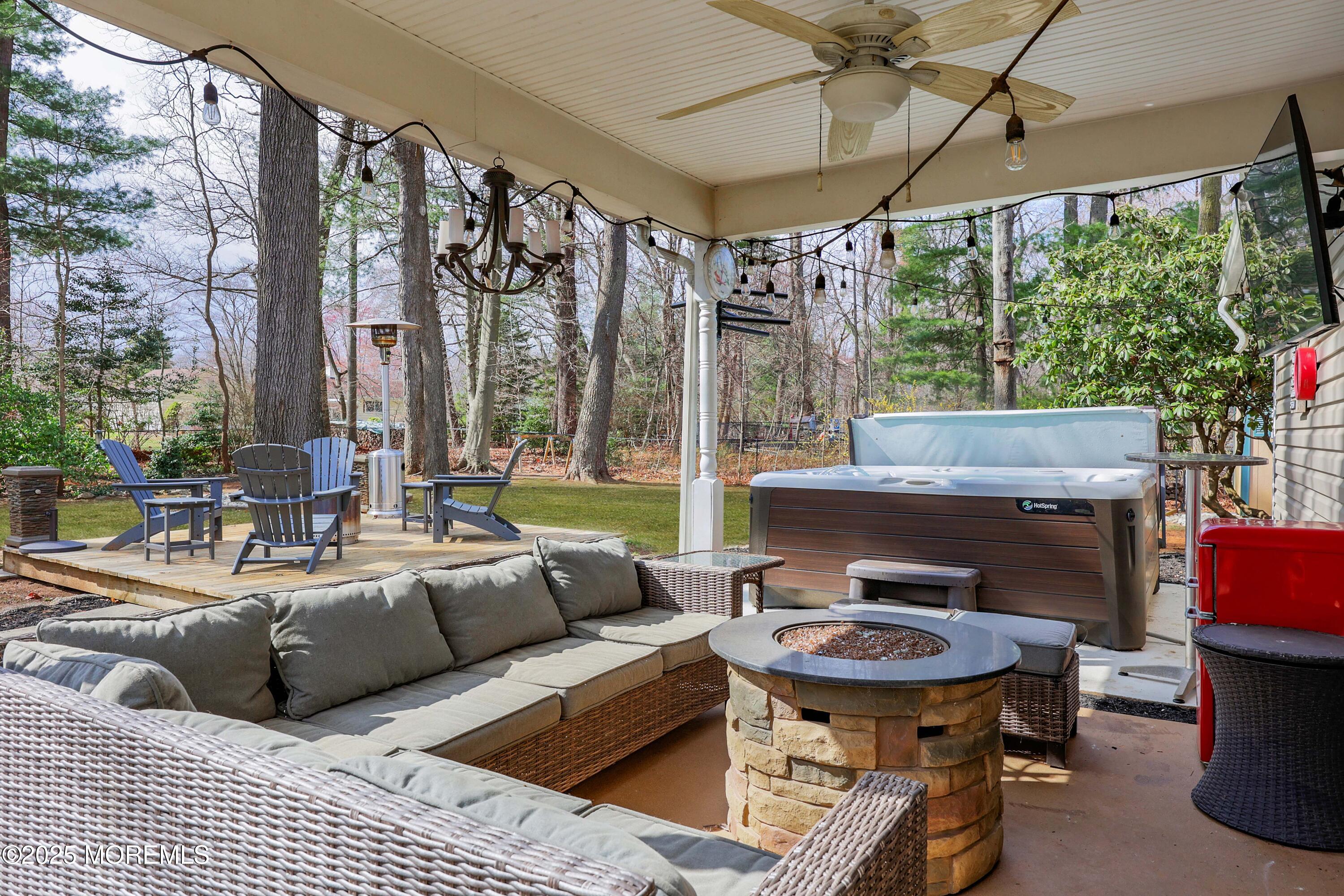 125 Jumping Brook Road Lincroft, NJ 07738 - Photo 16 of 47 a outdoor space with patio couch and a table