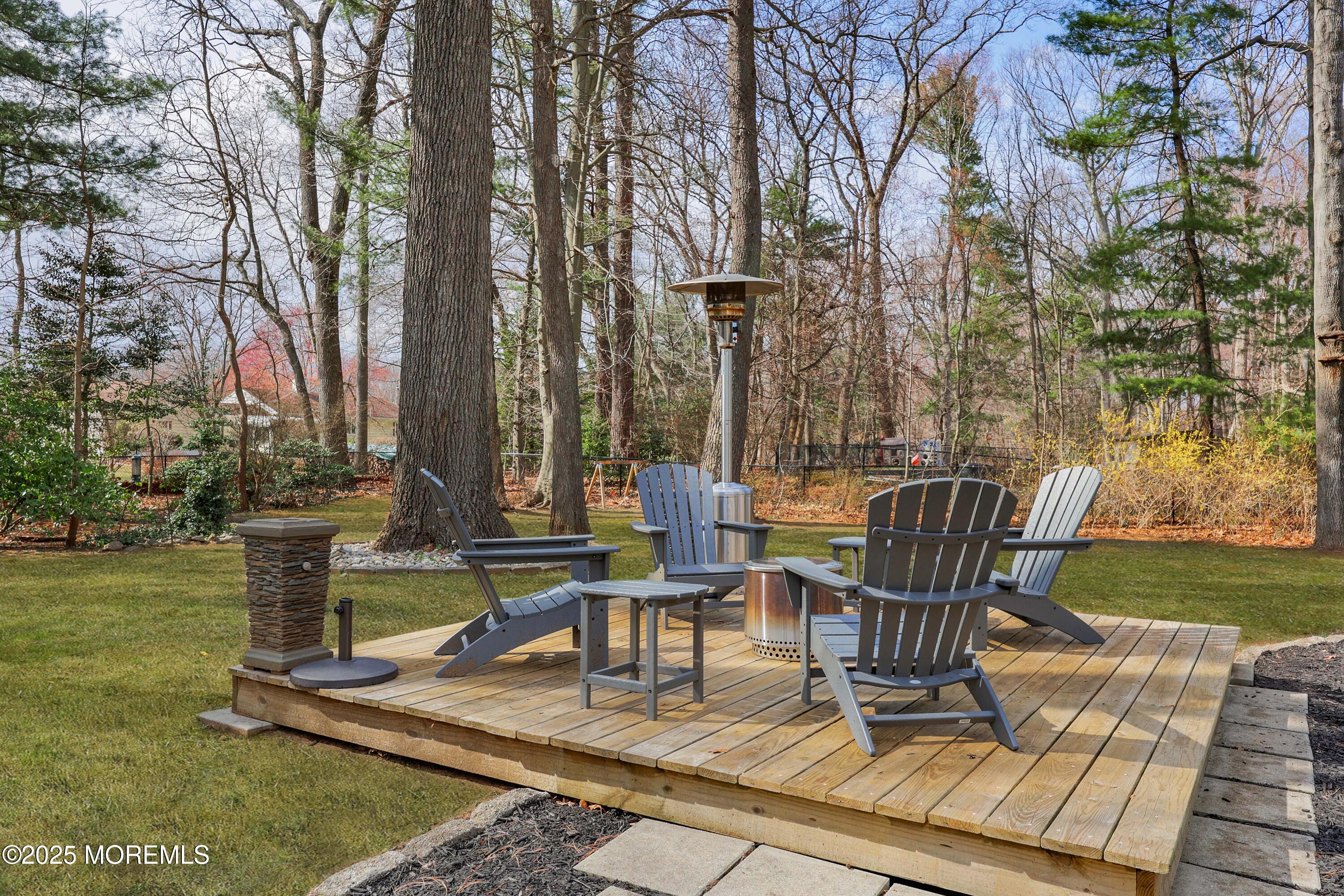 125 Jumping Brook Road Lincroft, NJ 07738 - Photo 17 of 47 a view of a chairs and tables in the patio