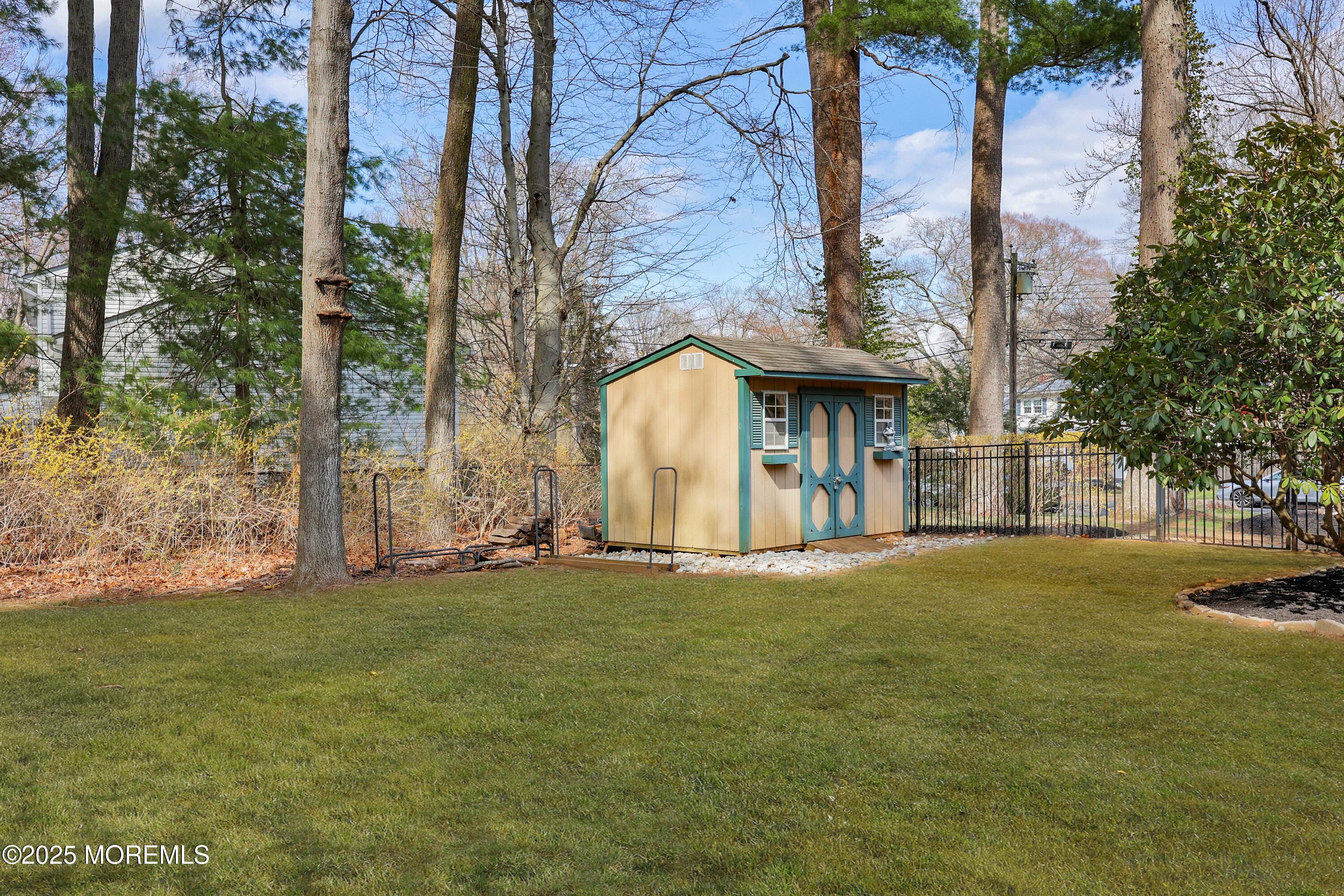 125 Jumping Brook Road Lincroft, NJ 07738 - Photo 20 of 47 a view of a house with a yard and tree s