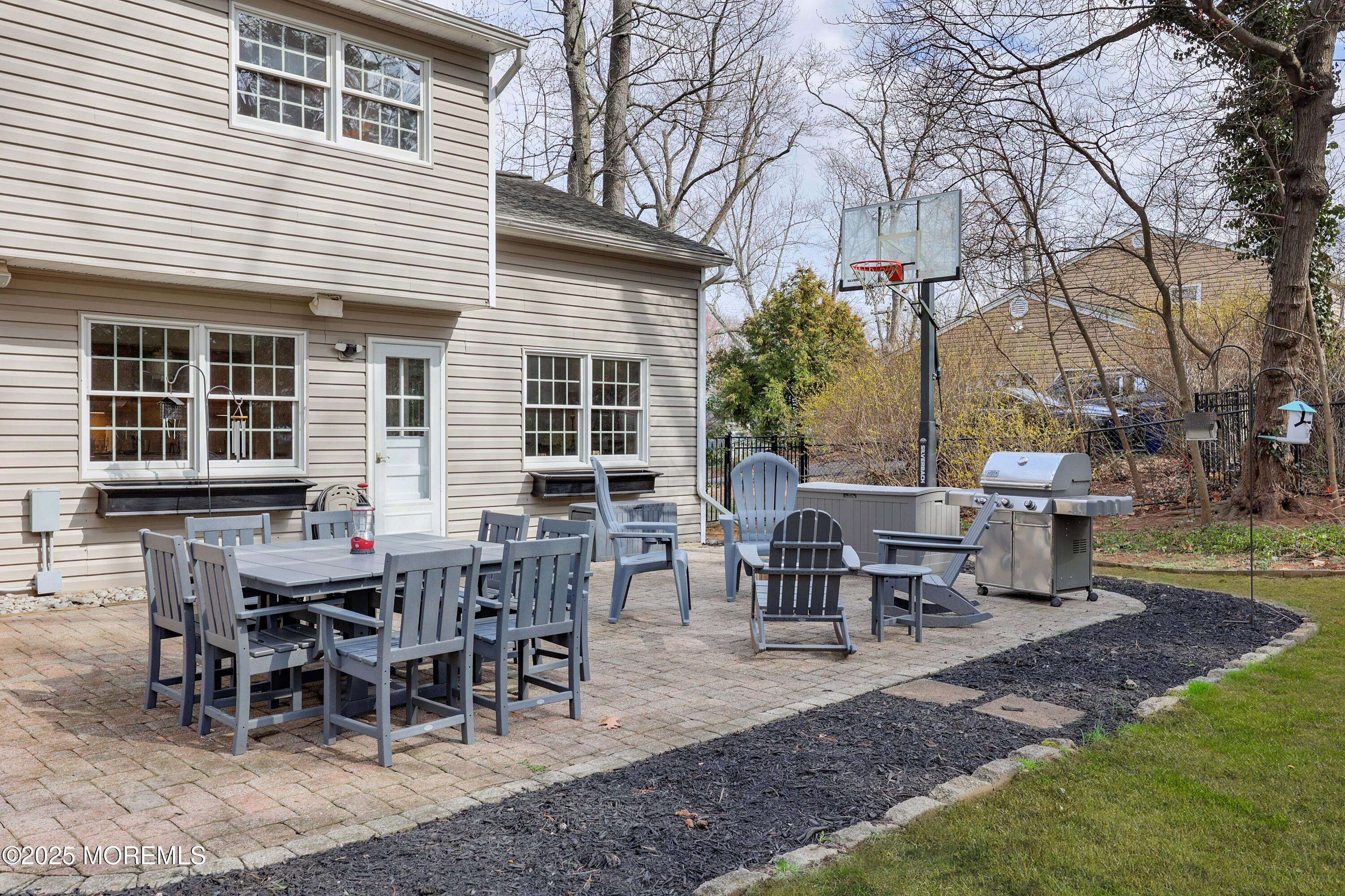 125 Jumping Brook Road Lincroft, NJ 07738 - Photo 23 of 47 a view of a house with backyard and sitting area