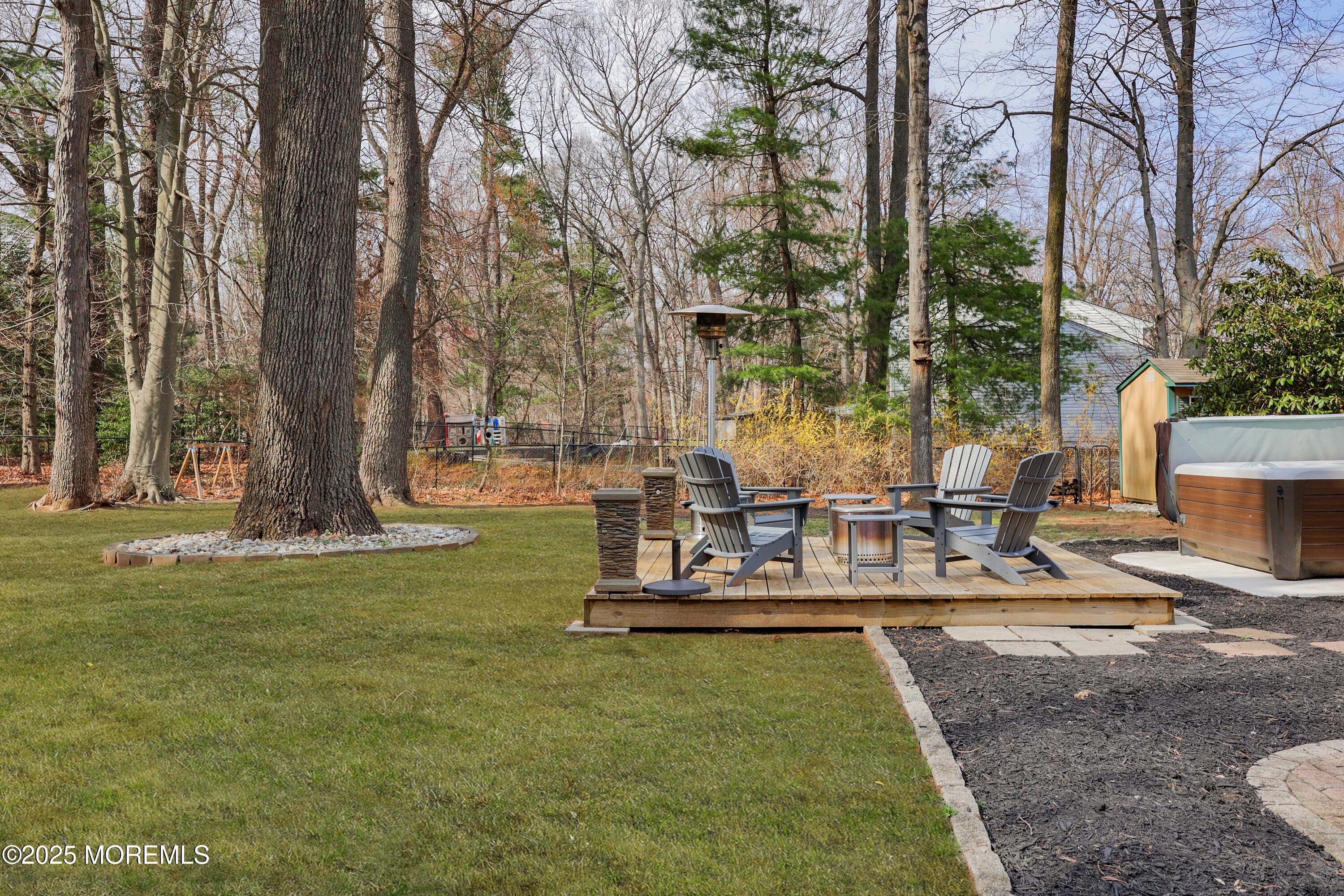 125 Jumping Brook Road Lincroft, NJ 07738 - Photo 24 of 47 a view of a swimming pool with sitting area